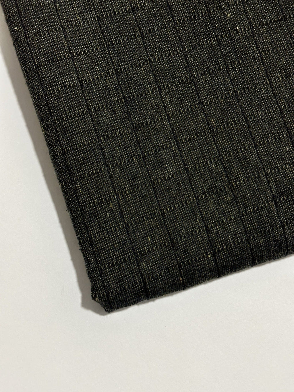Dark charcoal handmade winter wool fabric with subtle narrow stripes