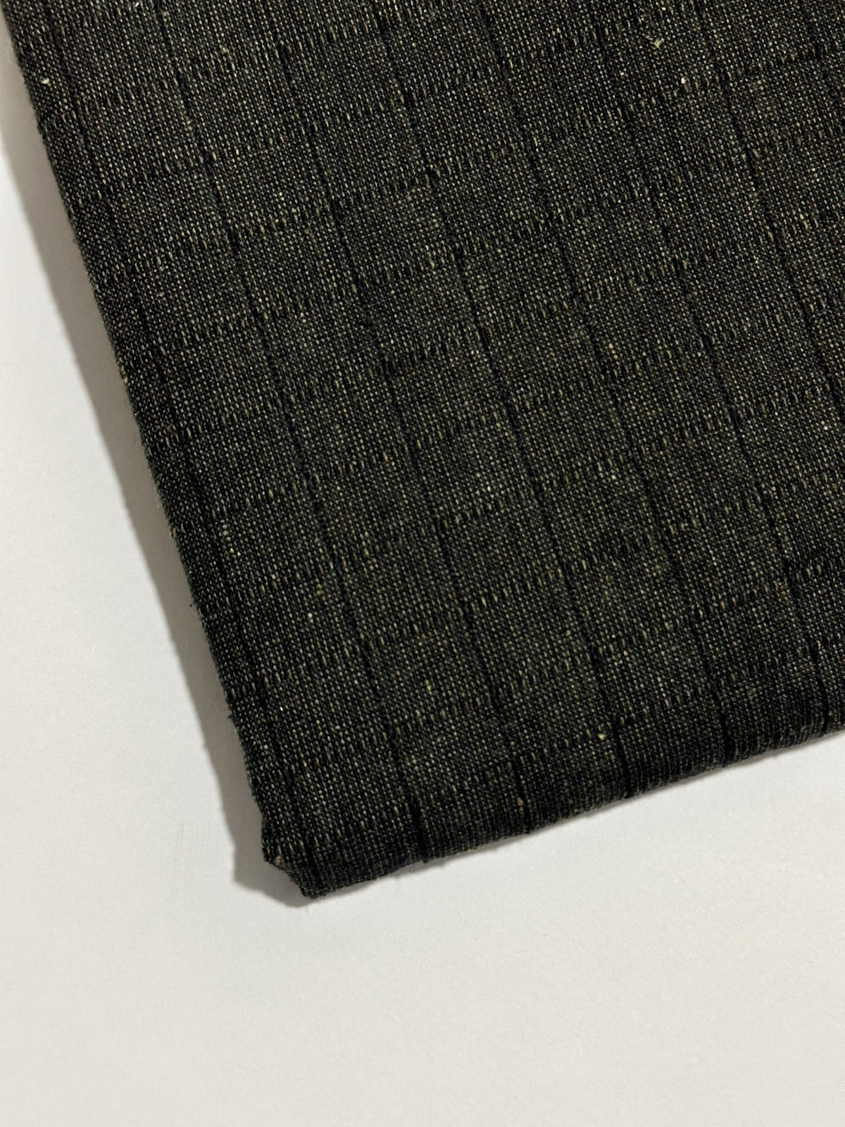 Dark charcoal handmade winter wool fabric with subtle narrow stripes