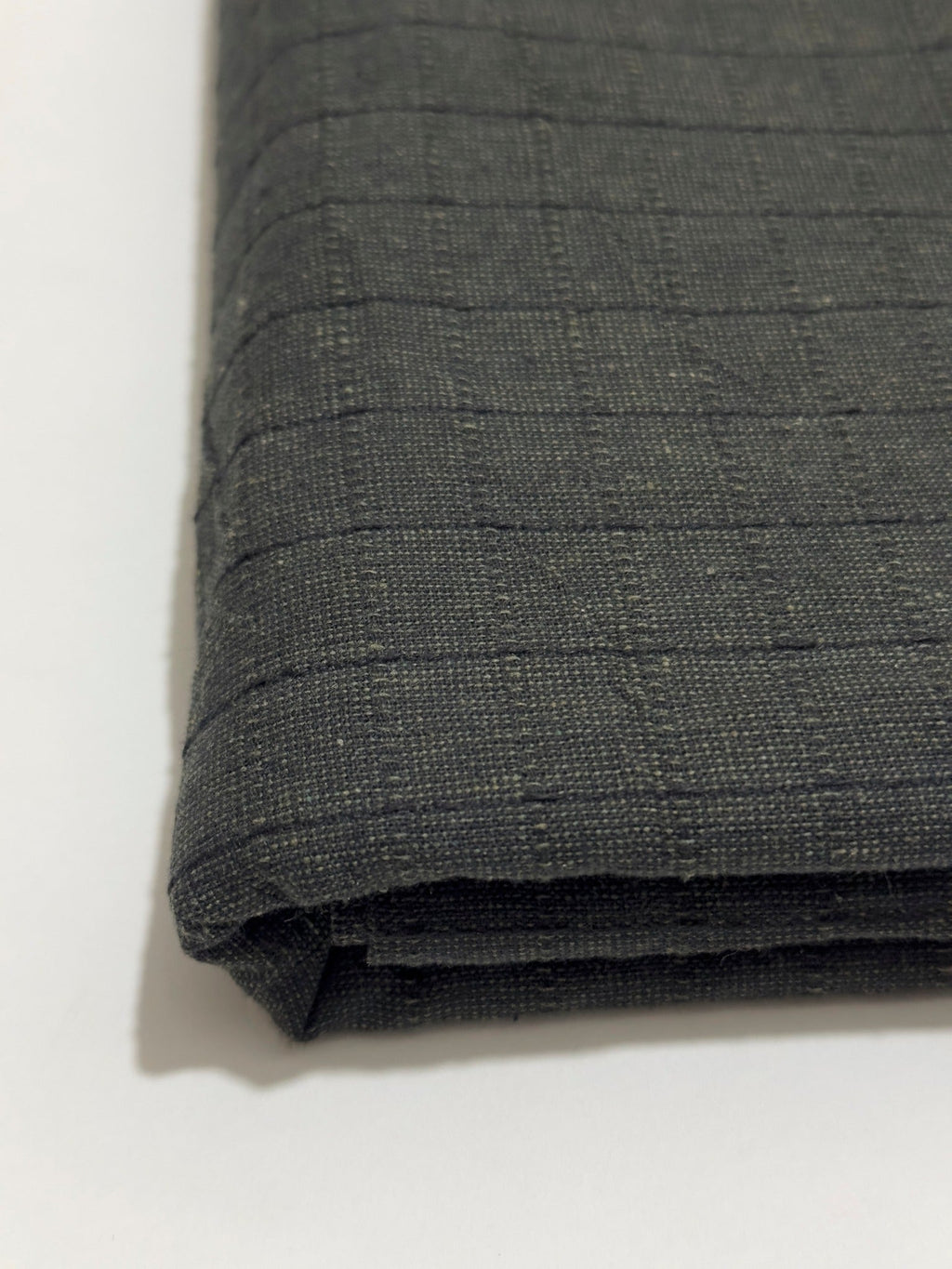 Charcoal black Dastoor winter wool fabric, folded detail