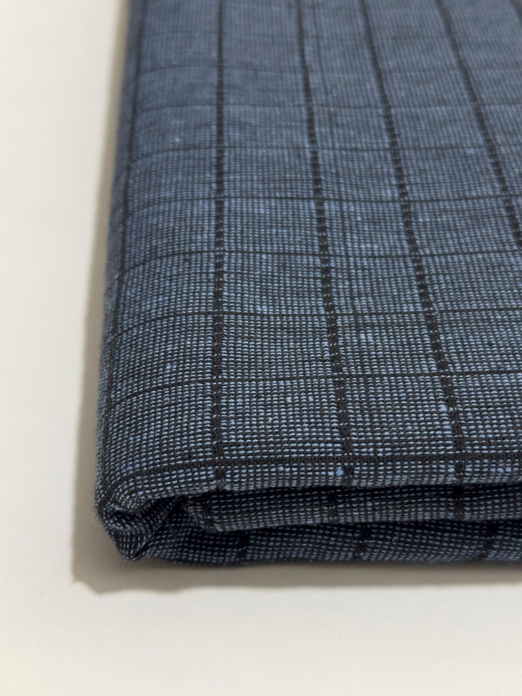 Blue grey checked Dastoor winter wool fabric, folded detail