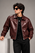 Men's Burgundy Textured Faux Leather Bomber Jacket worn by male model